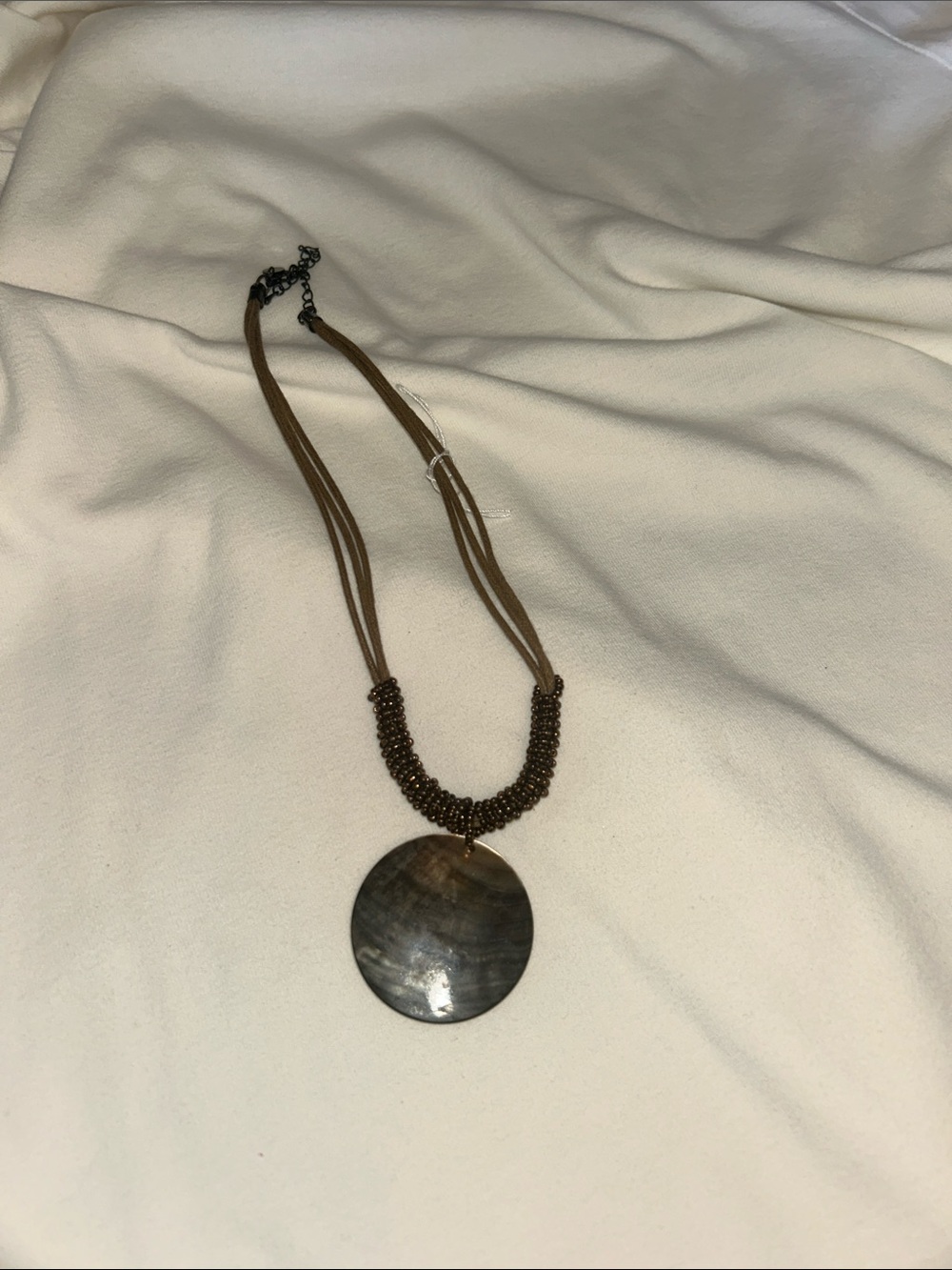 Brown Multistrand Necklace with Round Shell Pendant
